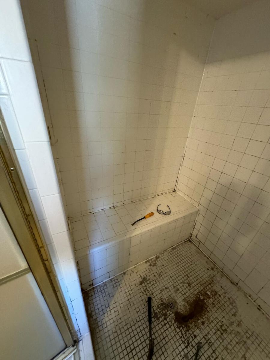 Old tiled bench and walls during demolition